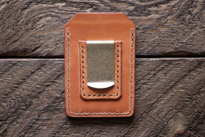 Russet handmade and hand stitched money clip wallet on wood