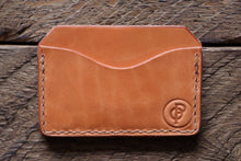 Russet handmade and hand stitched horizontal card case wallet on wood
