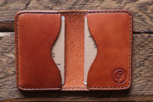 Brown handmade and hand stitched leather bifold wallet